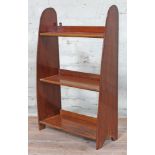 An early 20th century mahogany bookcase each side formed from a propeller, height 76cm.