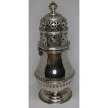 A hallmarked silver sugar castor, London 1925, height 17cm, wt. 8oz. Condition - ding to top,