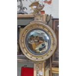 A Regency convex mirror with eagle, diam. 47cm.