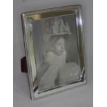 A hallmarked silver photo frame, height 22cm.