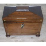 A Regency rosewood tea caddy of sarcophagus form, length 22cm.