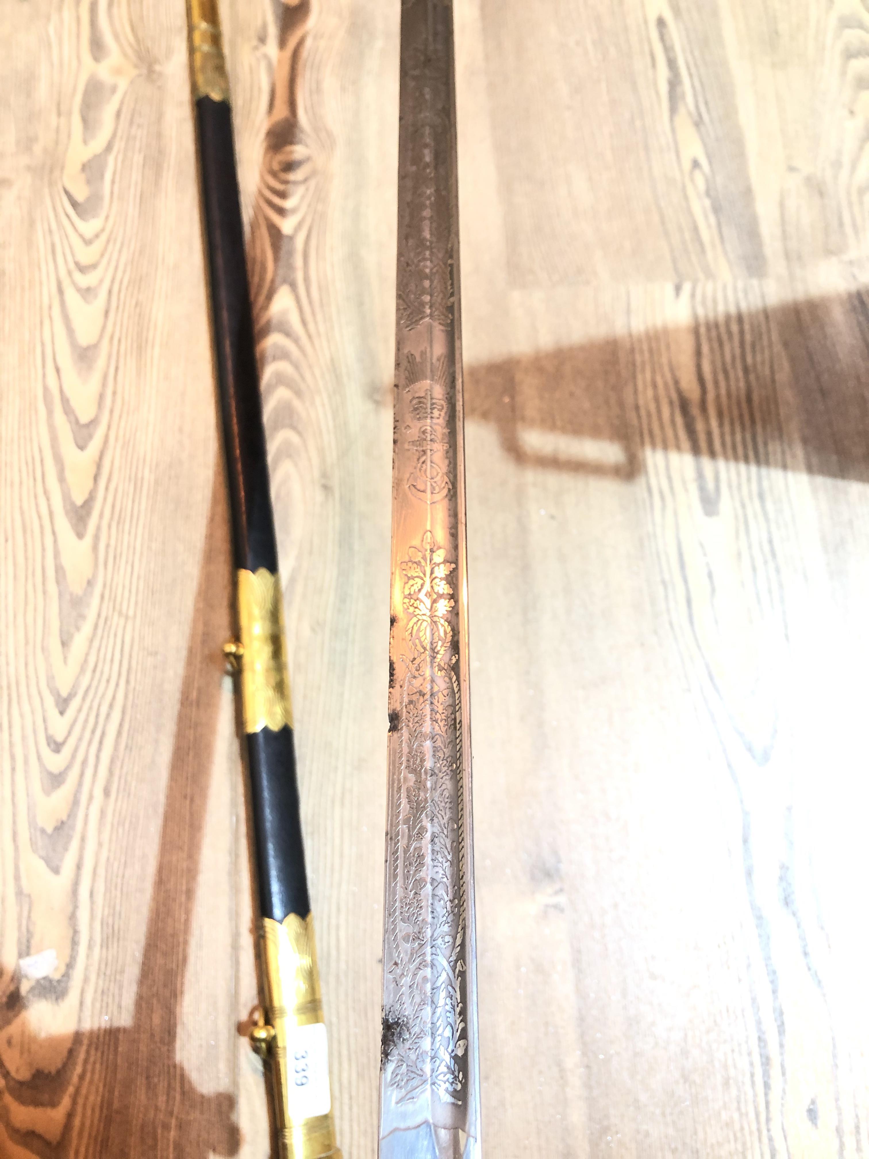 An Elizabeth II Navy officer's sword, the etched blade signed Gieves, with folding gilt brass hilt - Image 12 of 15