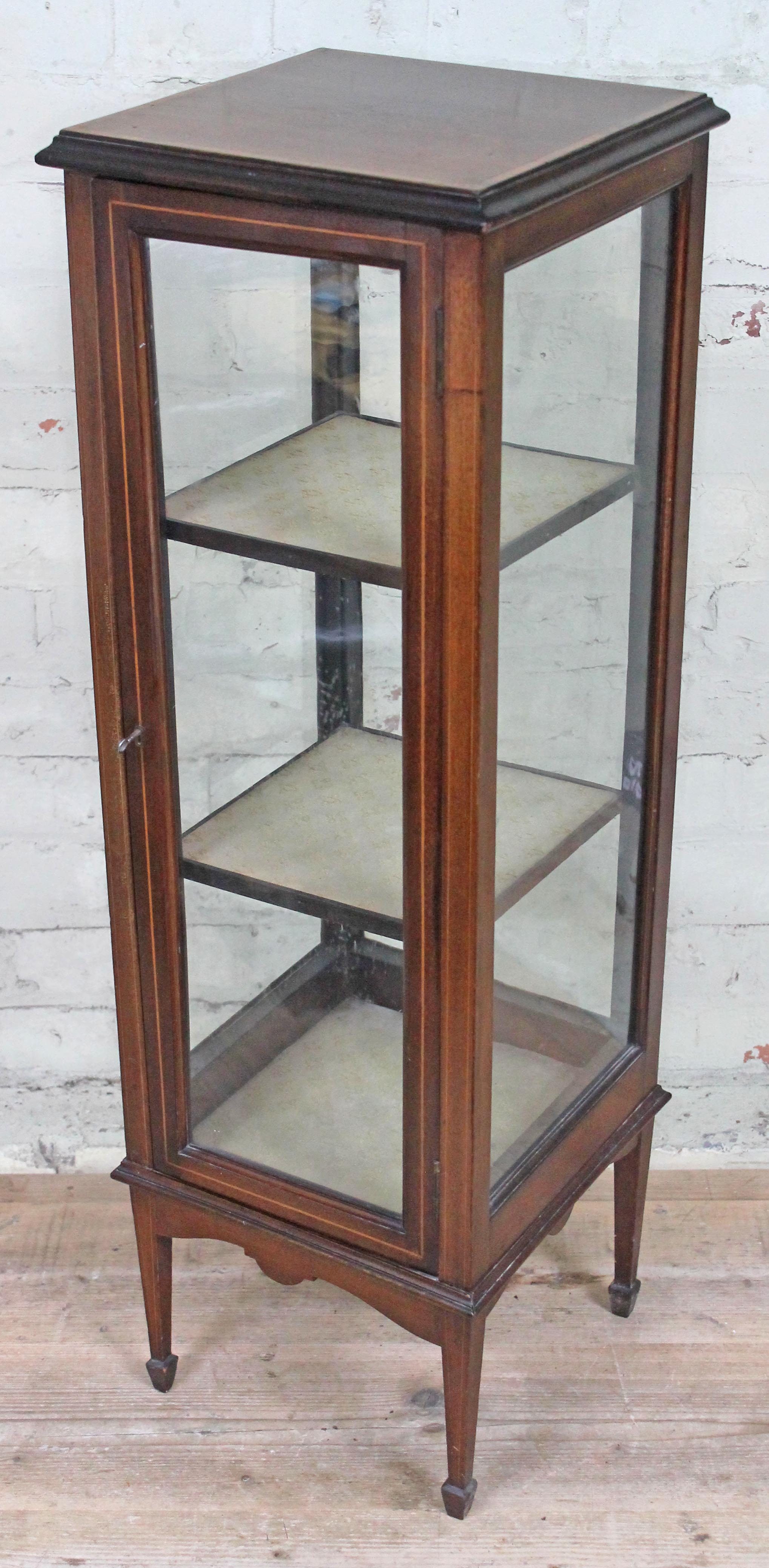 An Edwardian cross banded mahogany four side glass display cabinet of narrow square form, height