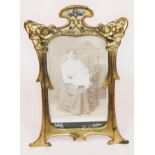 An Edwardian Art Nouveau gilt metal and enamel photo frame, height 23cm.