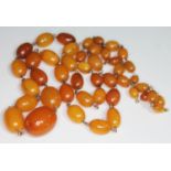 A single strand of butterscotch amber beads, length 74cm, gross wt. 35.8g.