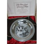 A hallmarked silver Peter Scott Christmas plate, wt. 6oz.