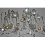 A mixed lot of hallmarked and sterling silver comprising souvenir spoons, sugar tongs and mustard
