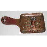 An Arts & Crafts Newlyn copper chamber stick decorated with fish, marked 'Newlyn', length 22cm.