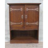 An Edwardian oak wall cabinet with Arts & Crafts style copper strap hinges, width 54cm, depth 22cm &