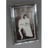 A hallmarked silver photo frame, height 15.5cm.