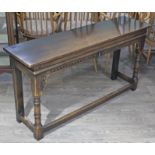 An aged oak side table by Rackstraw, width 137cm, depth 36cm & height 71.5cm. Condition - very good,