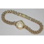 A ladies hallmarked 9ct gold wristwatch with hallmarked 9ct gold strap, gross wt. 13.63g.