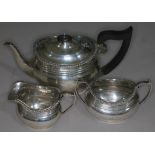 A three piece hallmarked silver tea set, gross wt. 25oz.