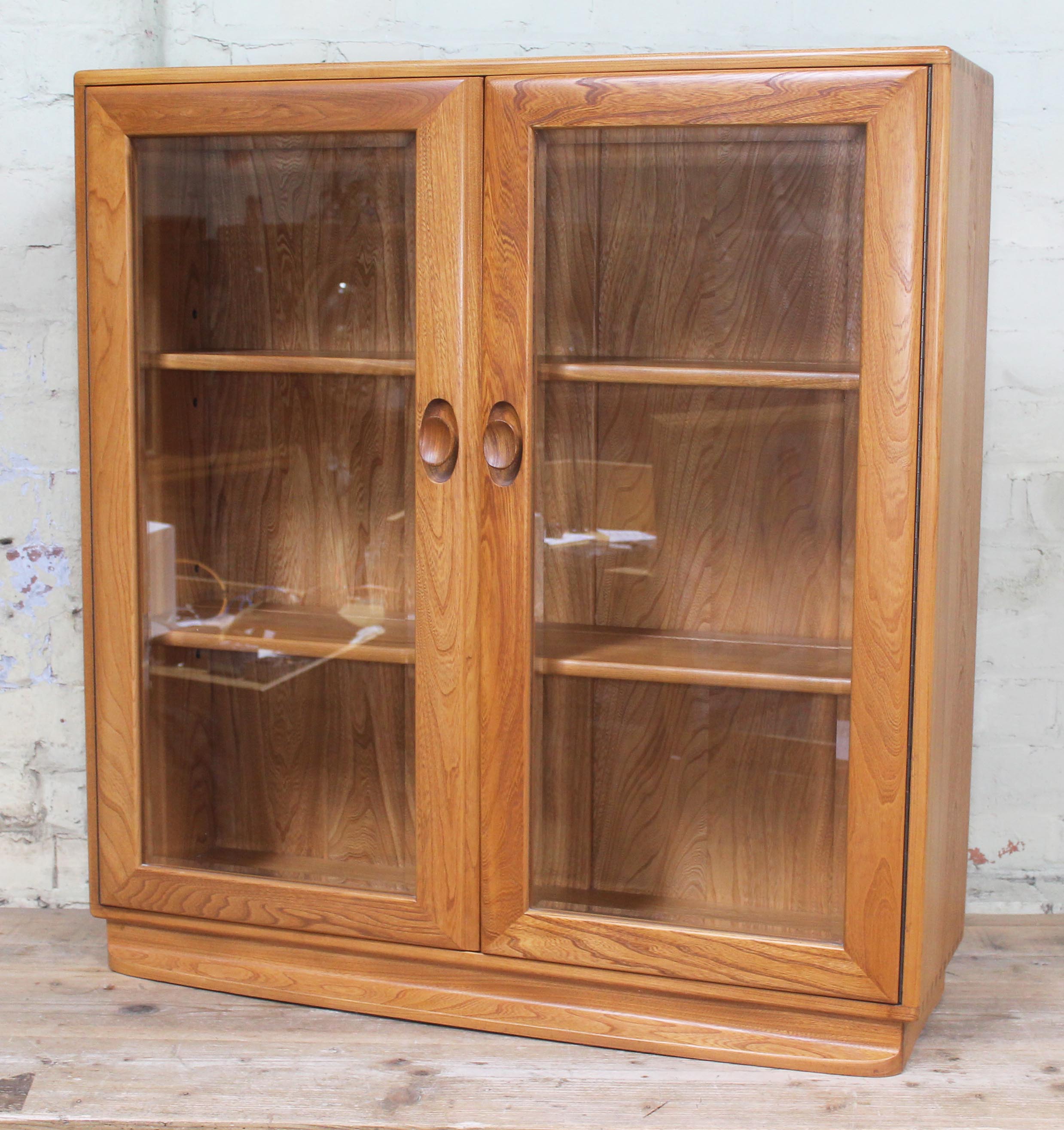 A elm and beech glazed bookcase with internal adjustable shelves and visible dovetail joints, - Image 2 of 2