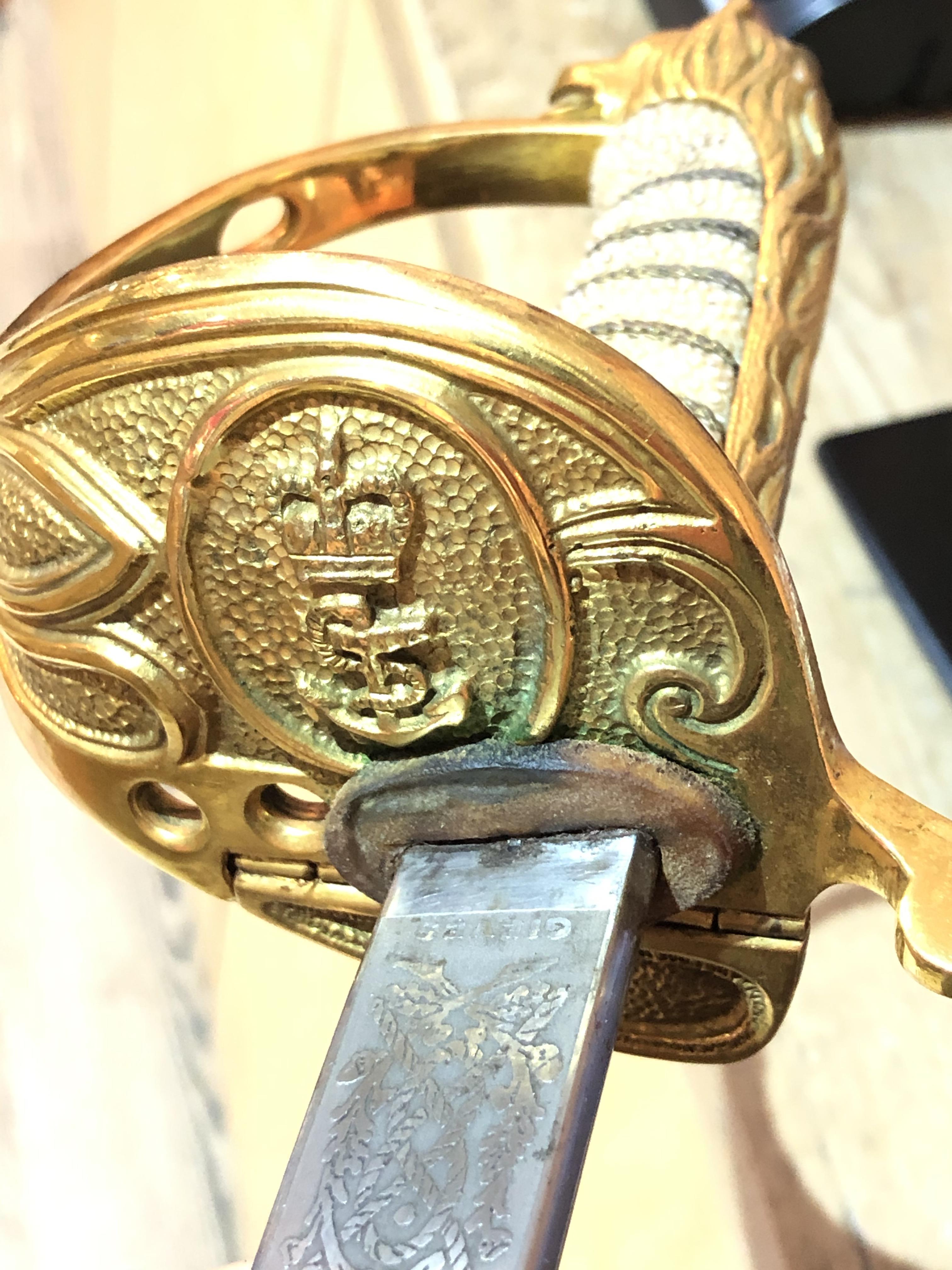 An Elizabeth II Navy officer's sword, the etched blade signed Gieves, with folding gilt brass hilt - Image 15 of 15