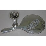 A mixed lot of hallmarked silver comprising a hand mirror, a silver topped jar and a small vase.