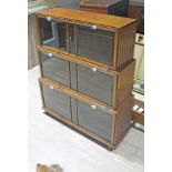 An Art Deco style stepped bookcase with bevelled edged drop down doors, width 100cm, depth 34cm &