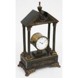 A French Empire and architectural style bronze and gilt brass mantel clock, height 44cm.