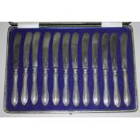 A cased set of 12 hallmarked silver handled knives.
