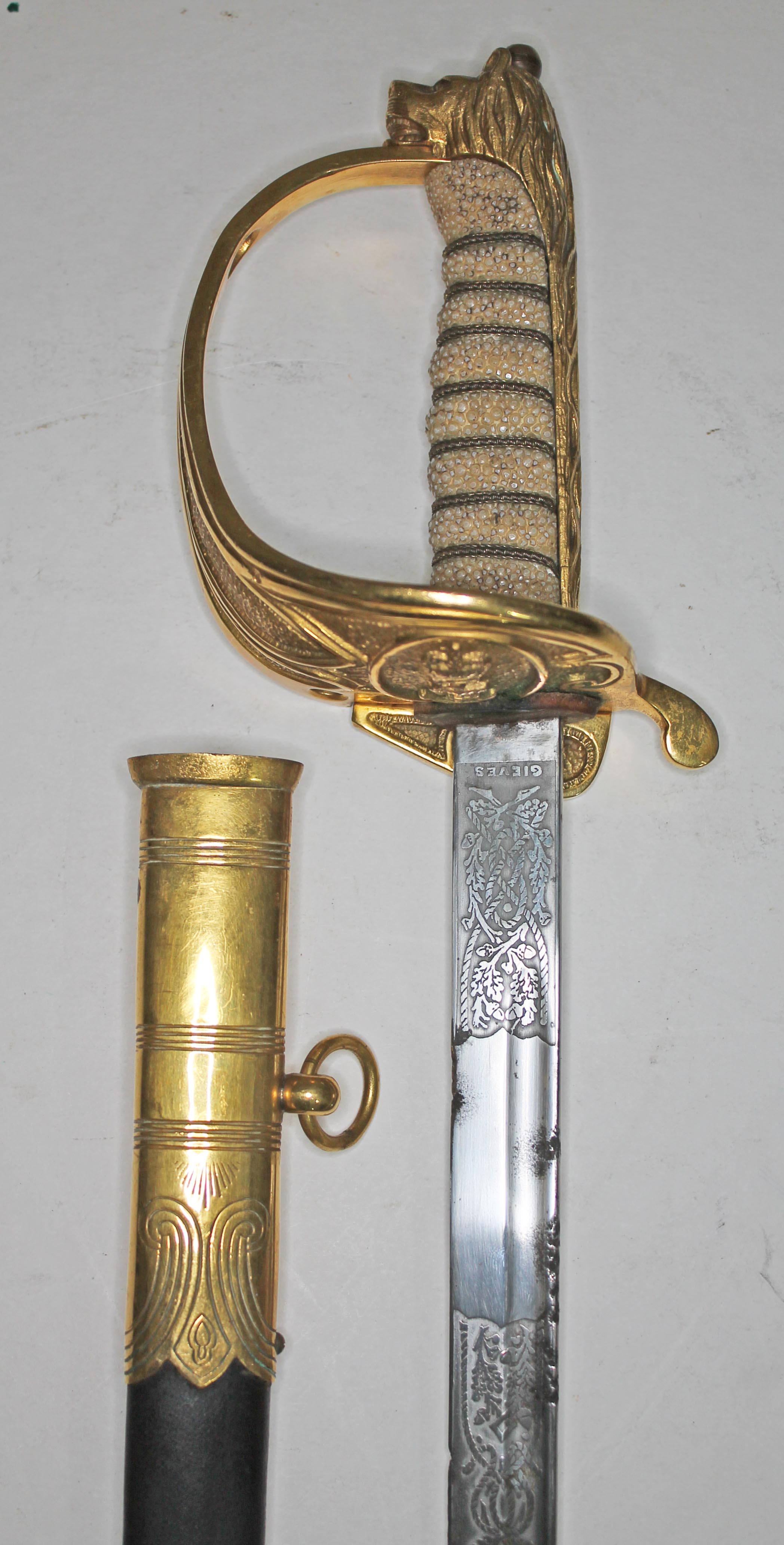 An Elizabeth II Navy officer's sword, the etched blade signed Gieves, with folding gilt brass hilt