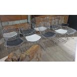 A set of nine wire frame chairs and a matching stool in the manner of Harry Bertoia, circa 1970s.