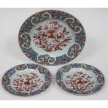 A set of three Chinese 18th century export dishes, each decorated with red and gilt central design