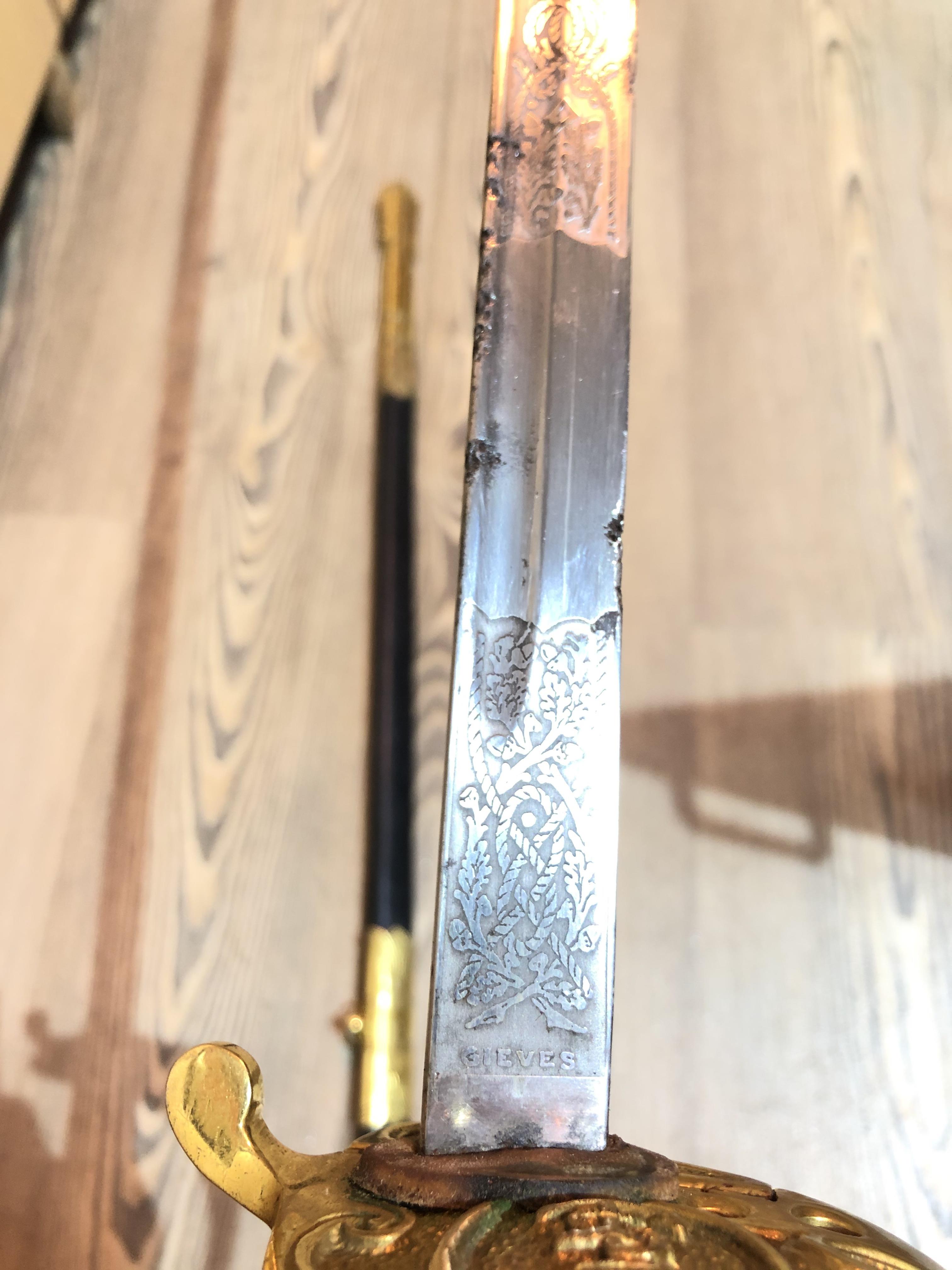 An Elizabeth II Navy officer's sword, the etched blade signed Gieves, with folding gilt brass hilt - Image 7 of 15