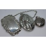 A mixed lot of silver and white metal comprising a Sherry decanter label, a embossed pendant and