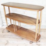 An Ercol blonde elm and beech trolley bookcase, length 92cm, depth 32cm & height 71cm. Condition -
