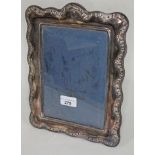 A hallmarked silver photo frame, 29cm x 22cm.