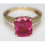 A 14ct gold ring set with a mixed cut pink stone, gross wt. 3.49g, size L.