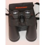 A pair of Celestron SkyMaster 25x70 binoculars with soft bag.