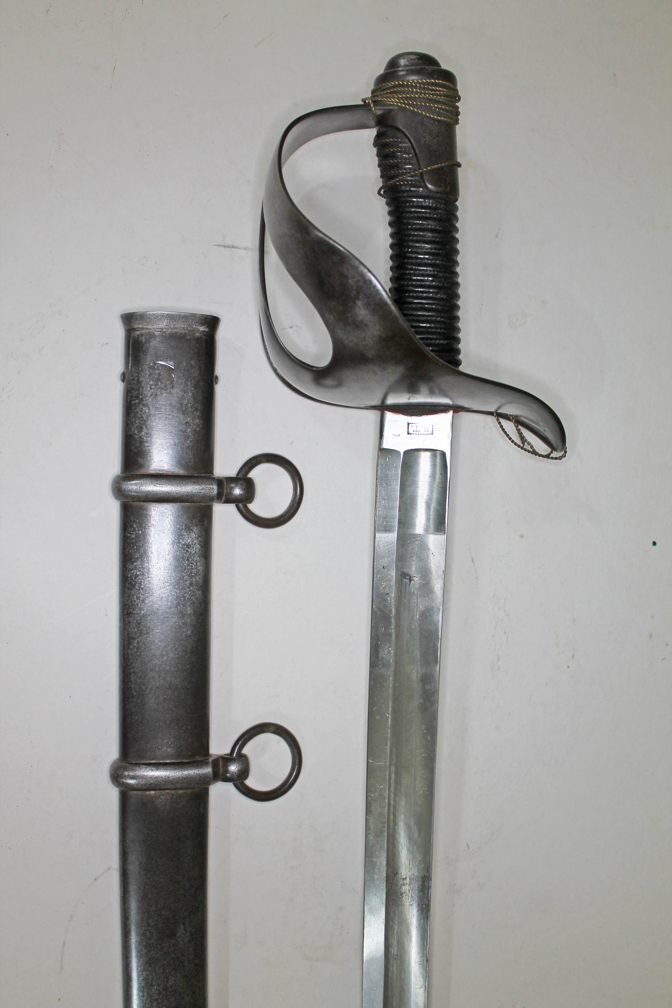 An Italian 1871 pattern heavy cavalry sword and scabbard, length 111cm.