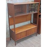 A retro 1960s room divider with glazed top section above open space and lower cabinet, width