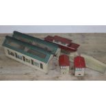 A group of Hornby model wooden railway accessories comprising a pre war double engine shed, a