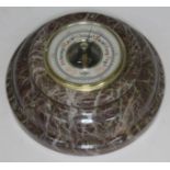 A compensated barometer by Smiths, within Scottish granite round frame, diam. 17.5cm.