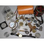 A mixed lot including two hallmarked silver ARP badges, a hallmarked silver medal, a 1922 dollar and