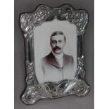 A contemporary hallmarked silver Art Nouveau style photo frame, height 21cm.