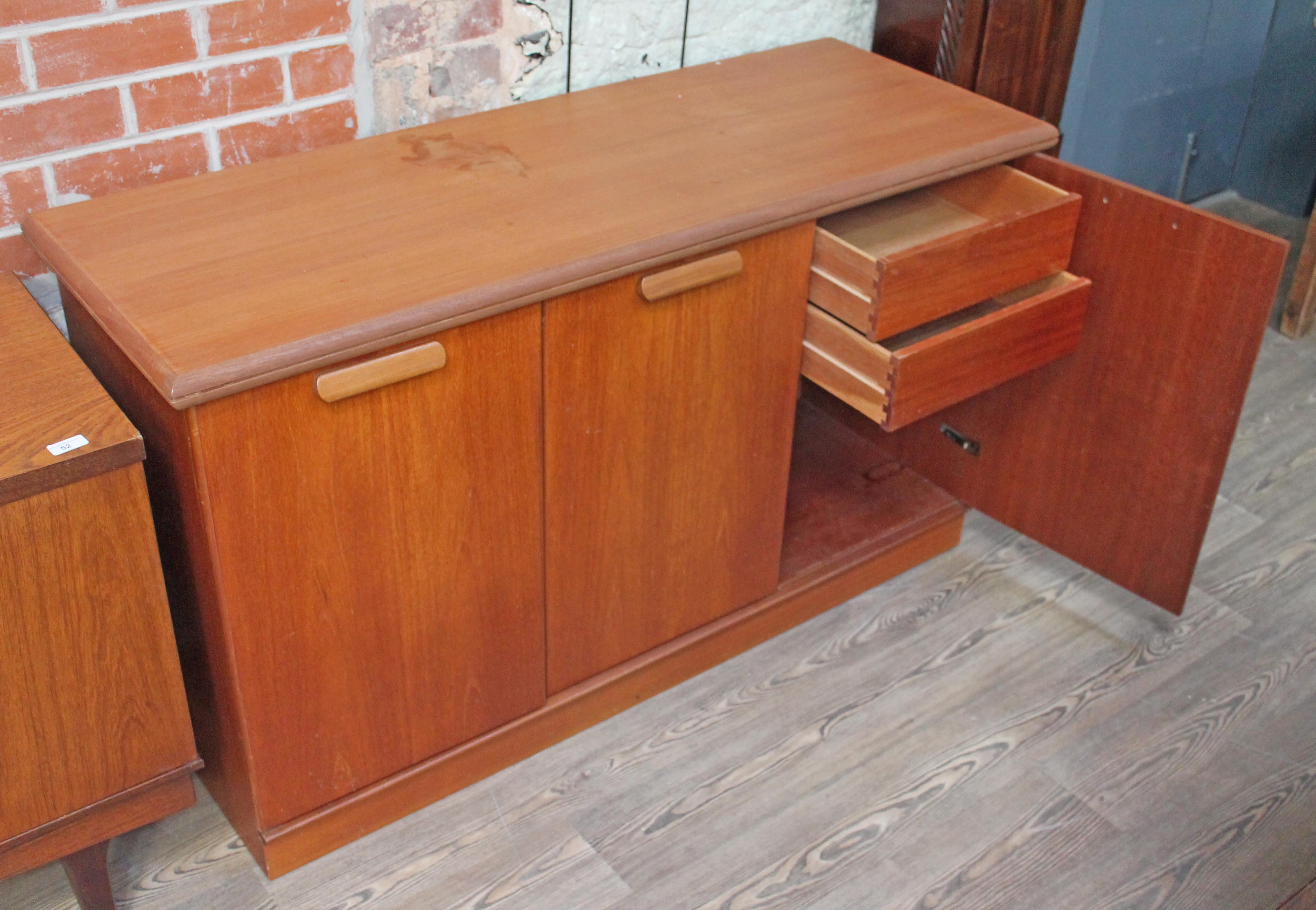 A White & Newton teak sideboard with interior drawers, length 140cm.