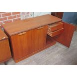 A White & Newton teak sideboard with interior drawers, length 140cm.