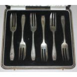 A cased set of hallmarked silver cake forks.