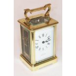 A glass carriage clock, the dial inscribed 'E.D. Bishop Bournemouth', height 14cm.