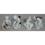 A set of four German porcelain tumbling cherubs by Rudolf Krammer, height 7cm-9cm each.