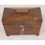 A Regency rosewood tea caddy of sarcophagus form, length 20.5cm.