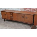 A 1960s teak sideboard, length 214cm, depth 49cm & height 74cm. Condition - generally ,good, a few