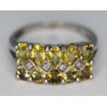 A 9ct white gold ring set with yellow and colourless stones, marked '9k', gross wt. 2.83g, size L.