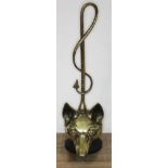A hunting themed door brass and cast metal door stop formed as a fox's head with riding crop, height