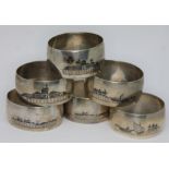 A set of six eastern white metal serviette rings.