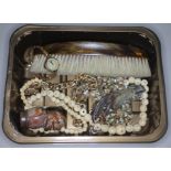 A box of bric a brac including a Scottish white metal mounted grouse claw brooch, a bap badge,