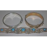 Two hallmarked silver bangles and a bracelet set with blue cabochons and marked 'Saban 800'.